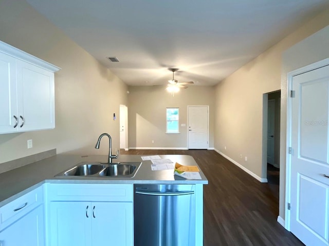 kitchen featuring sink, dark wood-type flooring, stainless steel dishwasher, ceiling fan, and white cabinets