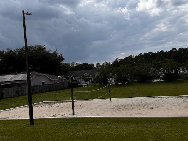 exterior space featuring volleyball court and a yard