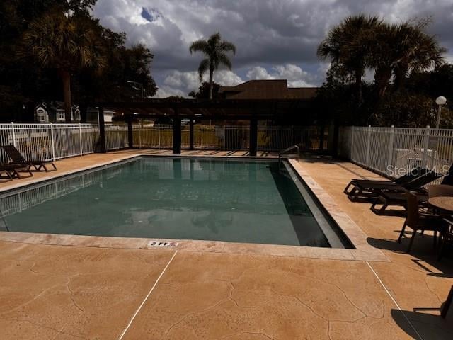 view of swimming pool featuring a patio