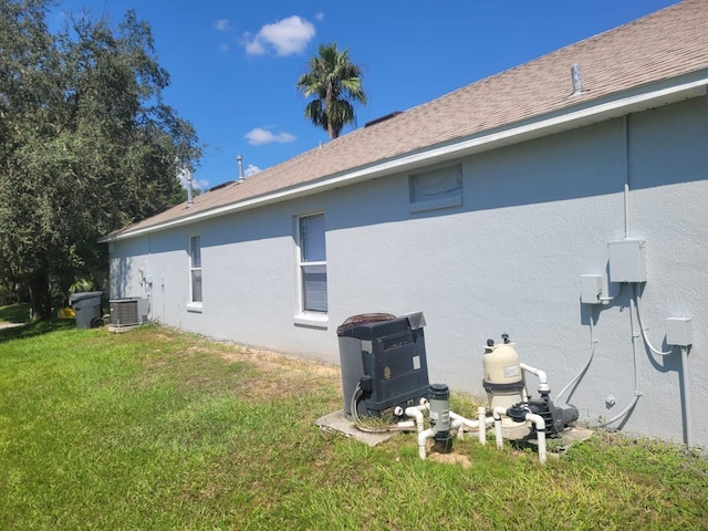 view of home's exterior with a lawn