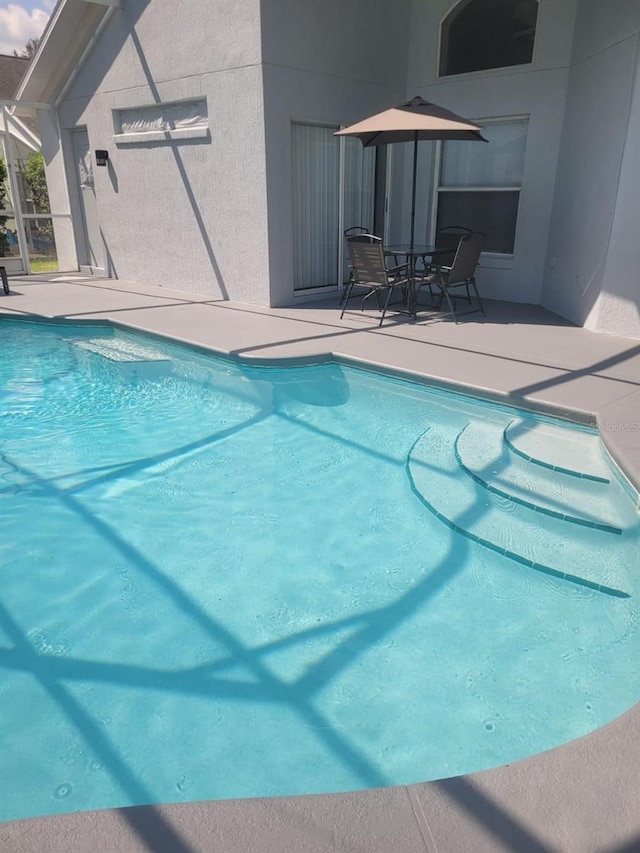 view of pool with a patio