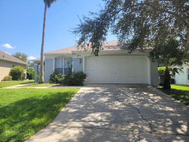 single story home with a front yard and a garage