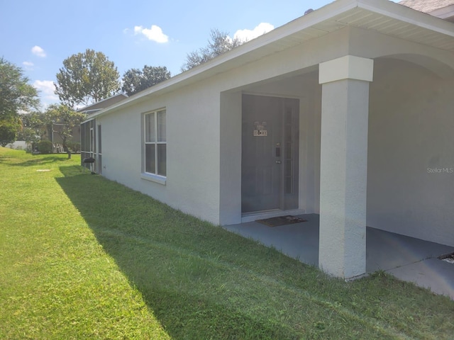 view of home's exterior featuring a yard