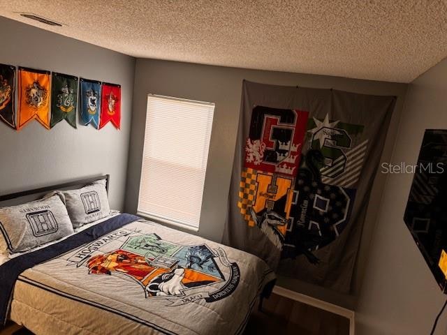 bedroom with a textured ceiling