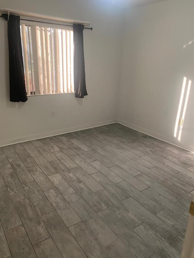 empty room featuring wood-type flooring