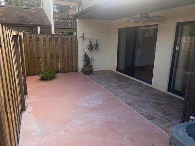 2647 Surrey Ct Unit 2647, Kissimmee, FL 34741 - view of patio / terrace featuring fence, ceiling fan, and central AC