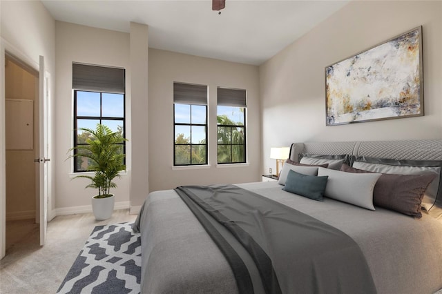 bedroom featuring ceiling fan, baseboards, and carpet floors