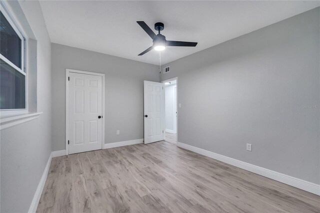 spare room with ceiling fan and light hardwood / wood-style floors