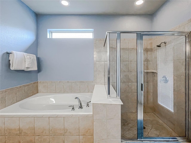 bathroom with shower with separate bathtub