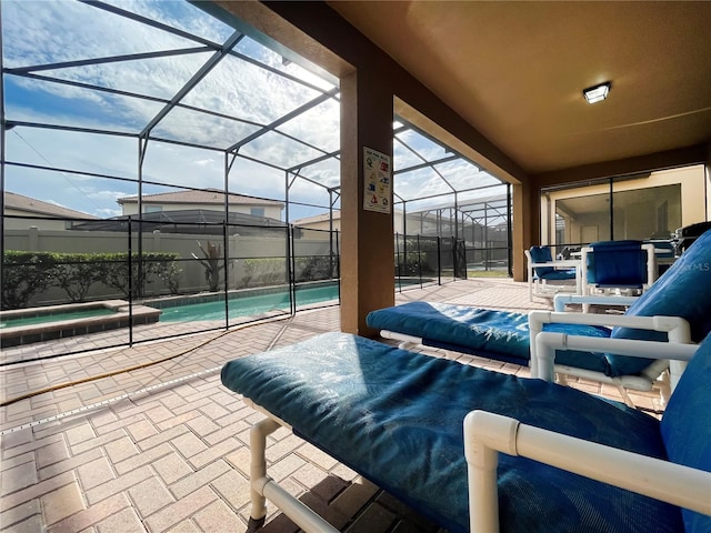 view of patio featuring glass enclosure and a fenced in pool