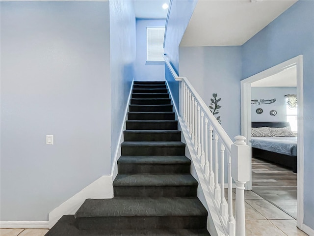 staircase featuring hardwood / wood-style flooring