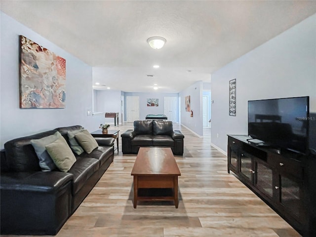 living room with light hardwood / wood-style flooring