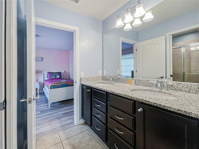 bathroom featuring vanity, walk in shower, and hardwood / wood-style floors