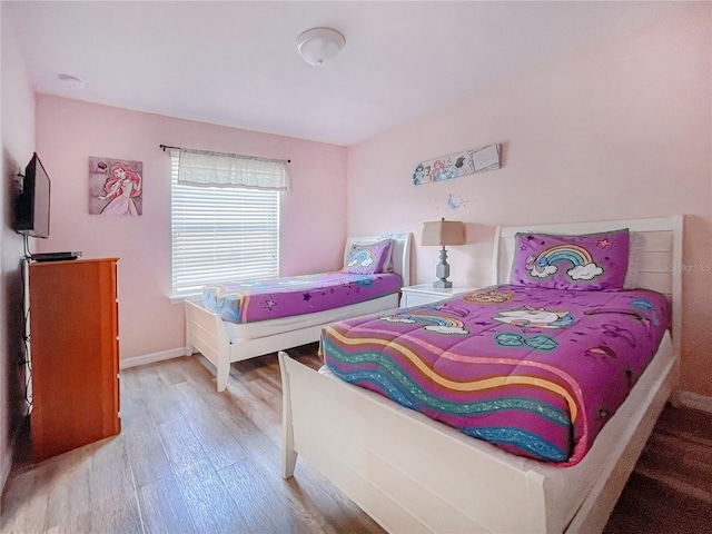 bedroom with light hardwood / wood-style floors