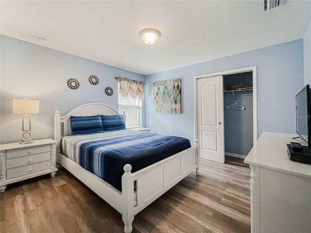 bedroom featuring a closet and wood-type flooring