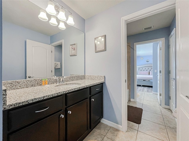 bathroom with vanity and tile patterned flooring