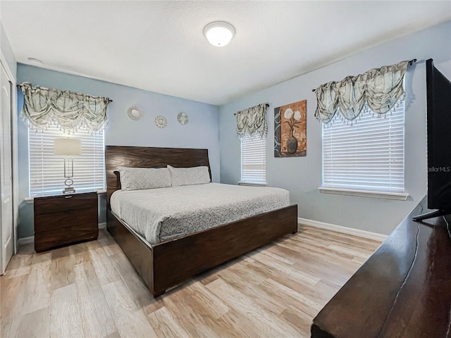 bedroom with light hardwood / wood-style floors