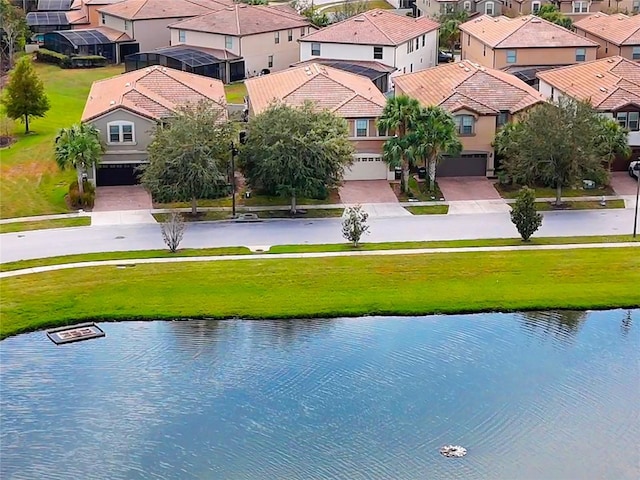 birds eye view of property featuring a water view