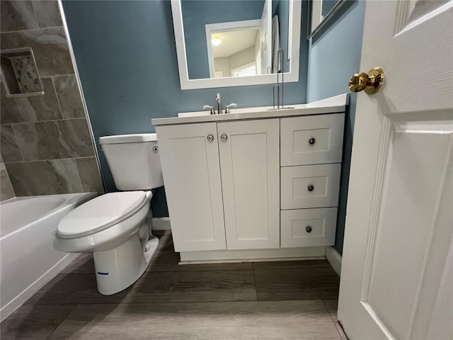 bathroom featuring toilet and vanity