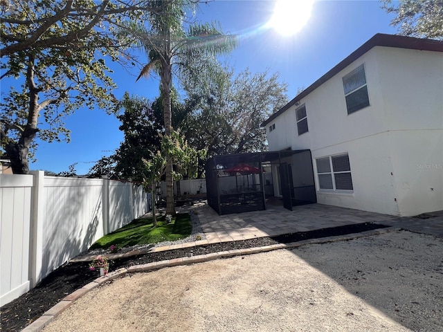 view of yard with a patio and a fenced backyard