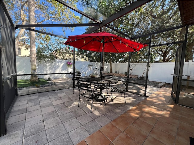 view of patio / terrace featuring a lanai and a fenced backyard