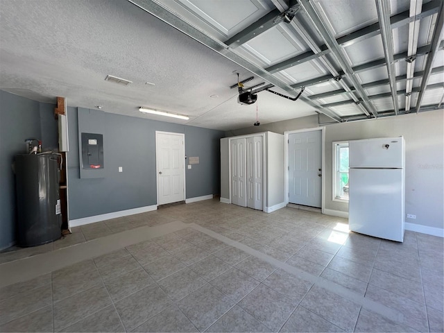 garage featuring a garage door opener, freestanding refrigerator, electric water heater, electric panel, and baseboards