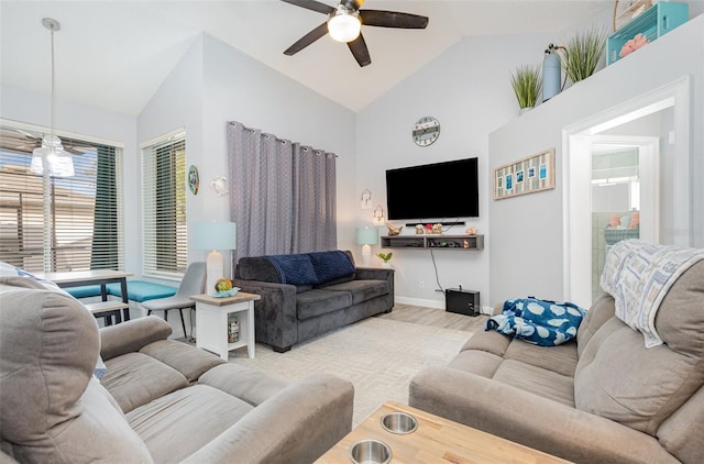 living room with light hardwood / wood-style flooring, ceiling fan, and high vaulted ceiling