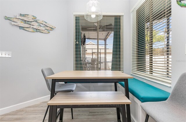 dining space with light wood-type flooring