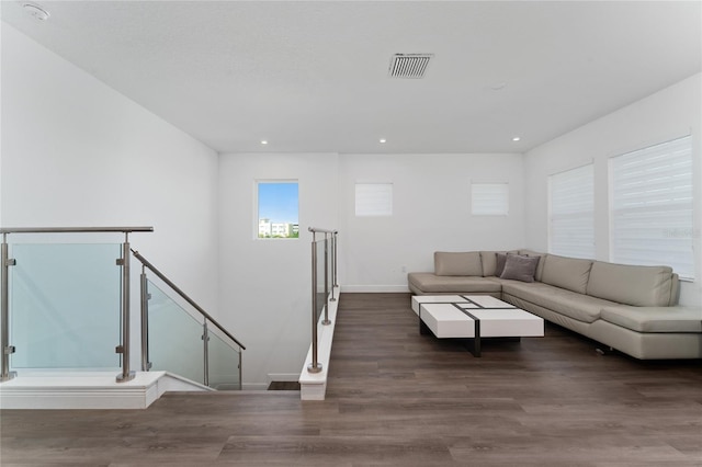 unfurnished living room with dark hardwood / wood-style floors