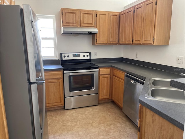 kitchen featuring appliances with stainless steel finishes and sink