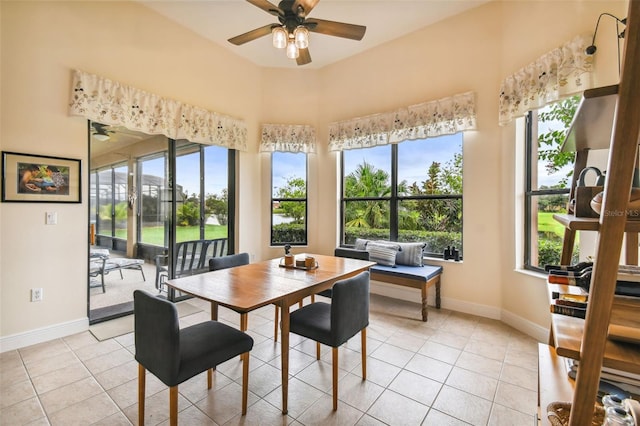 tiled dining room with ceiling fan