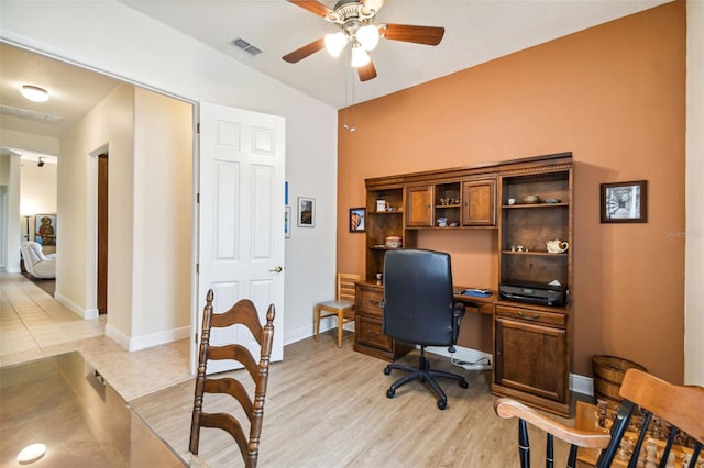 office space with light hardwood / wood-style flooring, ceiling fan, and vaulted ceiling