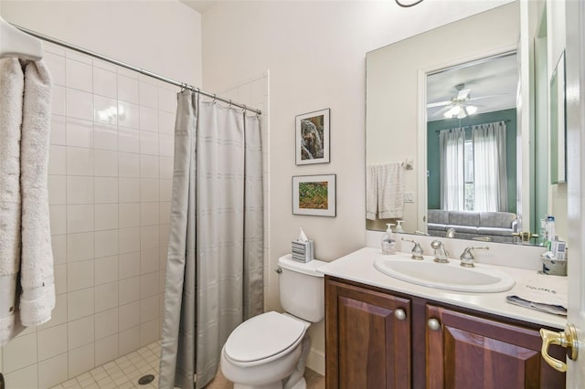 bathroom featuring a shower with curtain, toilet, ceiling fan, and vanity