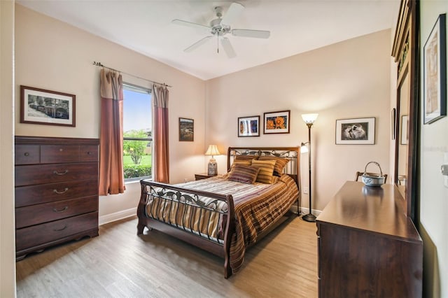 bedroom featuring ceiling fan and light hardwood / wood-style floors