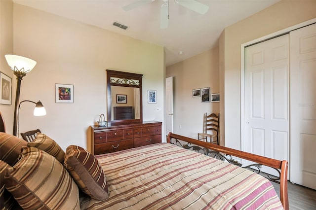 bedroom featuring a closet, wood-type flooring, and ceiling fan