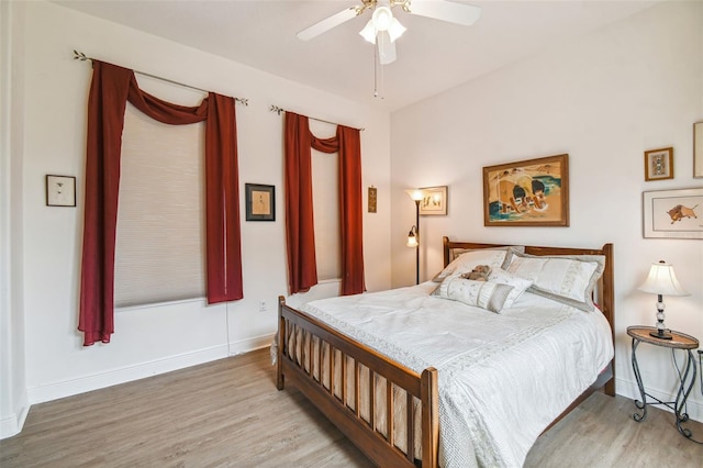 bedroom with ceiling fan and light hardwood / wood-style floors