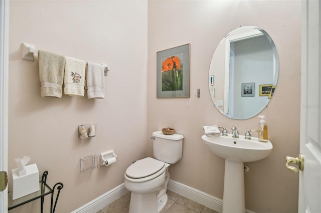 bathroom featuring tile patterned flooring and toilet