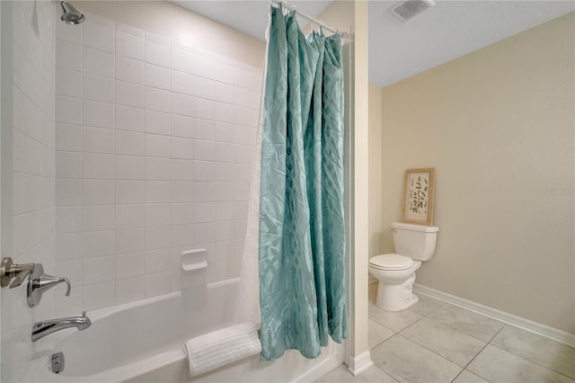 bathroom featuring tile patterned floors, shower / tub combo, and toilet