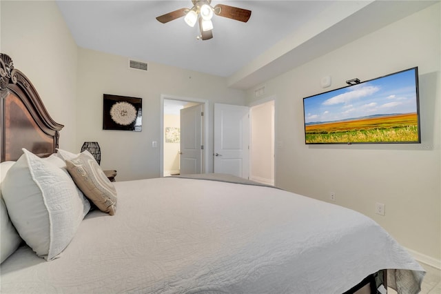 bedroom featuring ensuite bath and ceiling fan