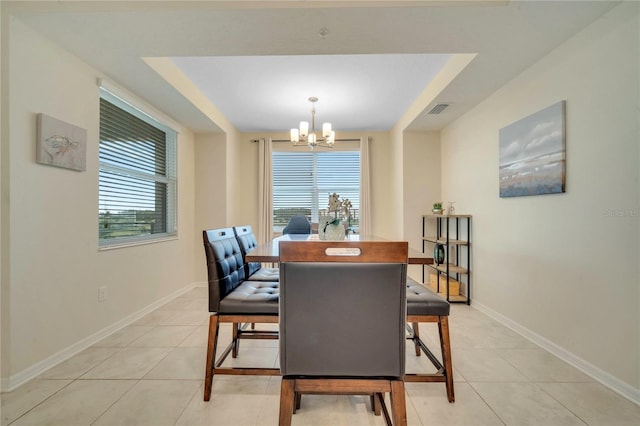 dining room with a notable chandelier and light tile patterned flooring