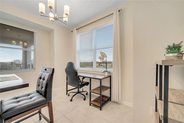 office featuring baseboards and a chandelier