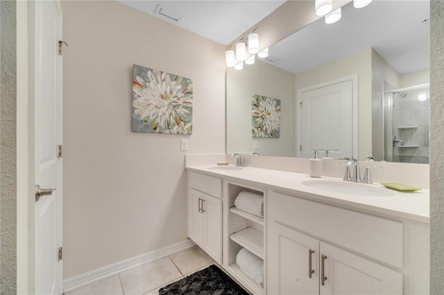 full bathroom with a stall shower, double vanity, a sink, and tile patterned floors