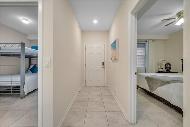 hallway featuring light tile patterned floors