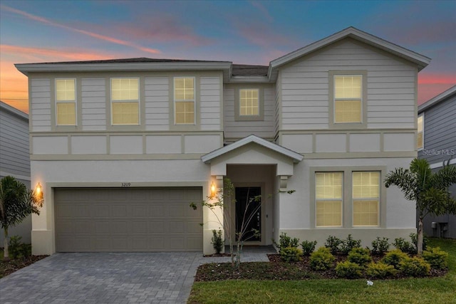 view of front of property with a garage