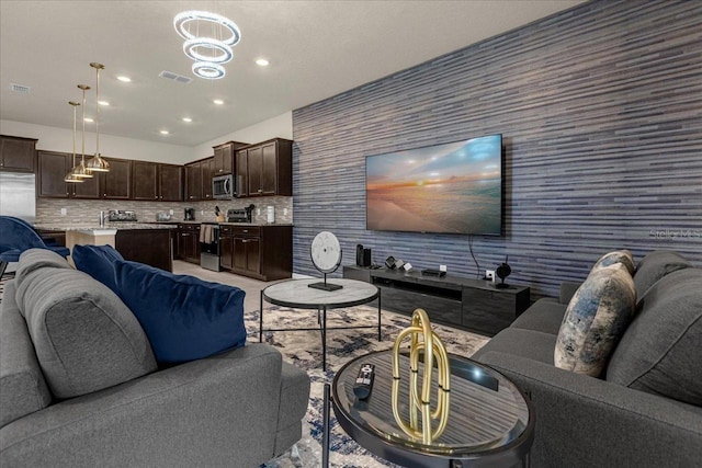 living room with a notable chandelier