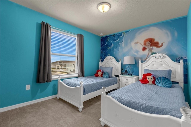 carpeted bedroom featuring a textured ceiling