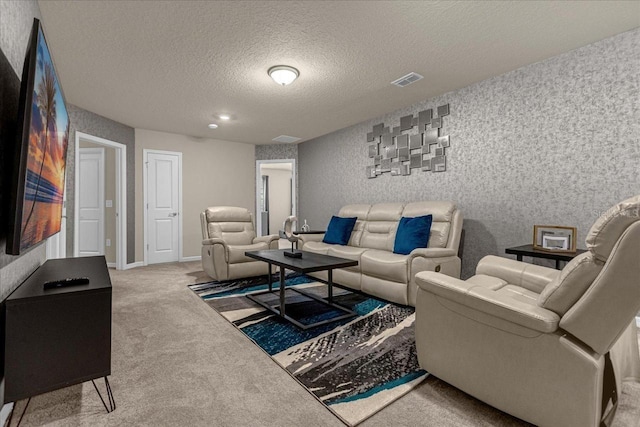 carpeted living room with a textured ceiling