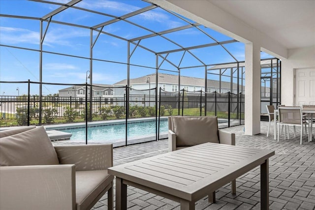 exterior space with a fenced in pool, a lanai, and an outdoor hangout area