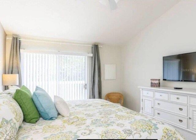 bedroom featuring vaulted ceiling and ceiling fan