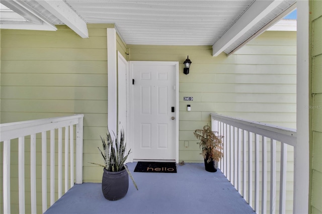 doorway to property featuring covered porch